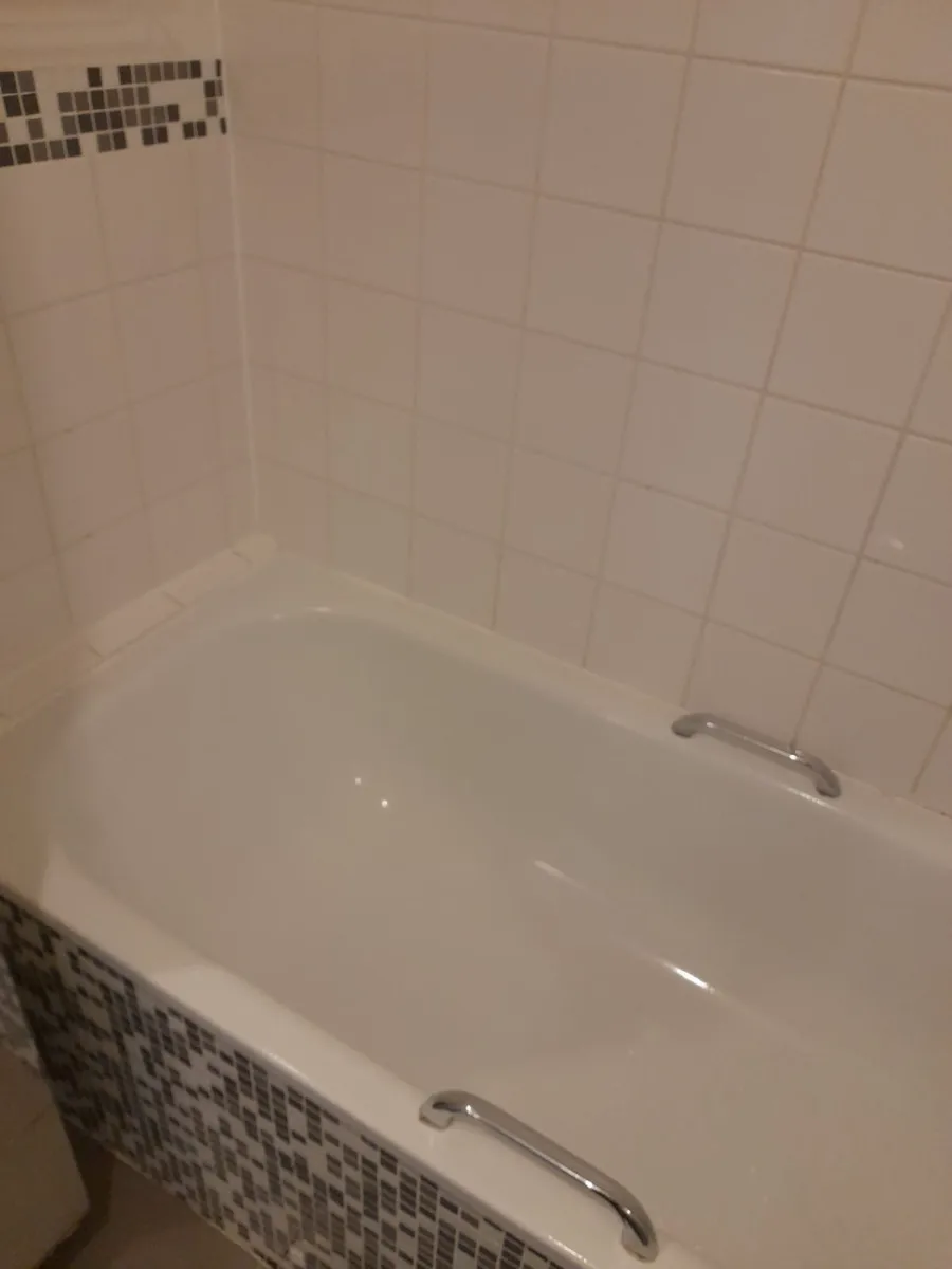 Bathtub and tile walls scrubbed bright, cleaned by Spark & Shine Cleaning Co. in Myrtle Beach, SC