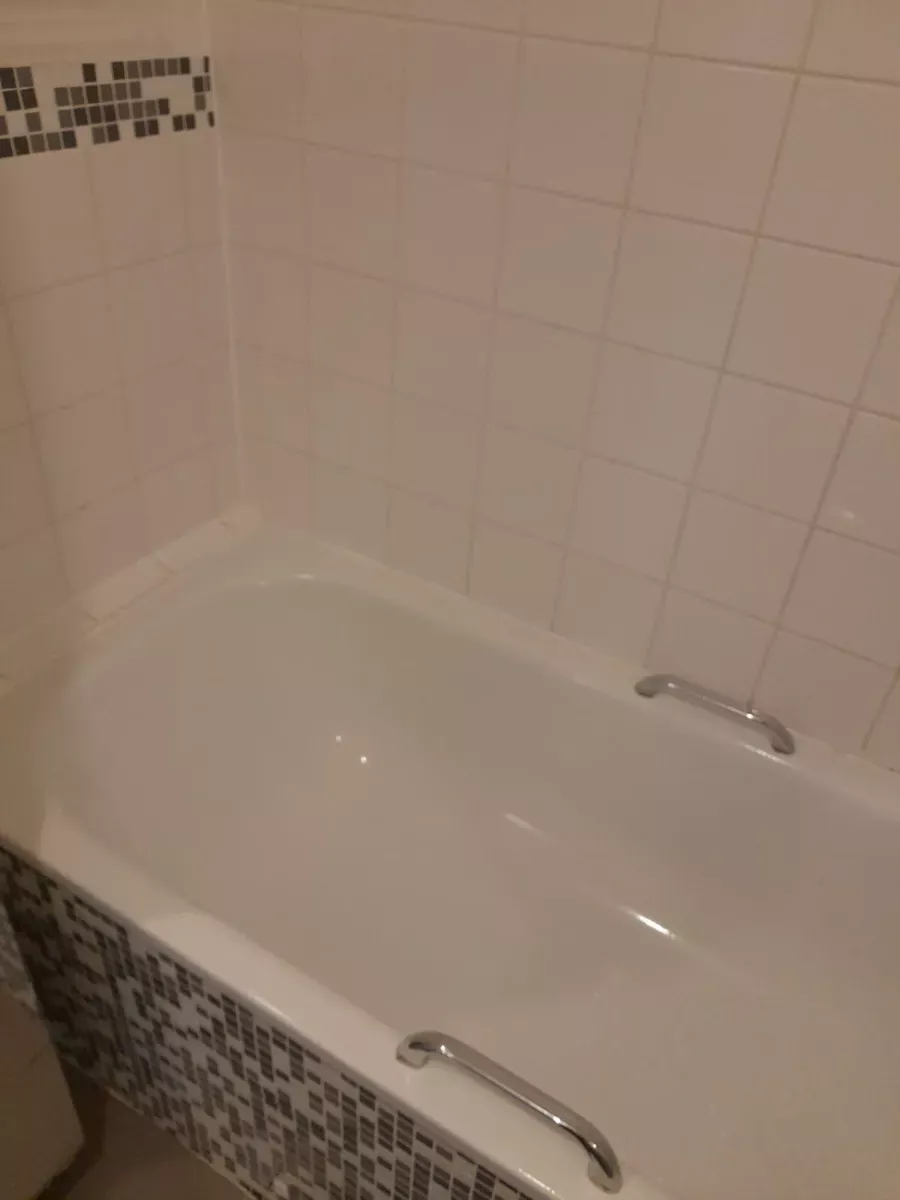 Bathtub and tile walls scrubbed bright, cleaned by Spark & Shine Cleaning Co. in Myrtle Beach, SC