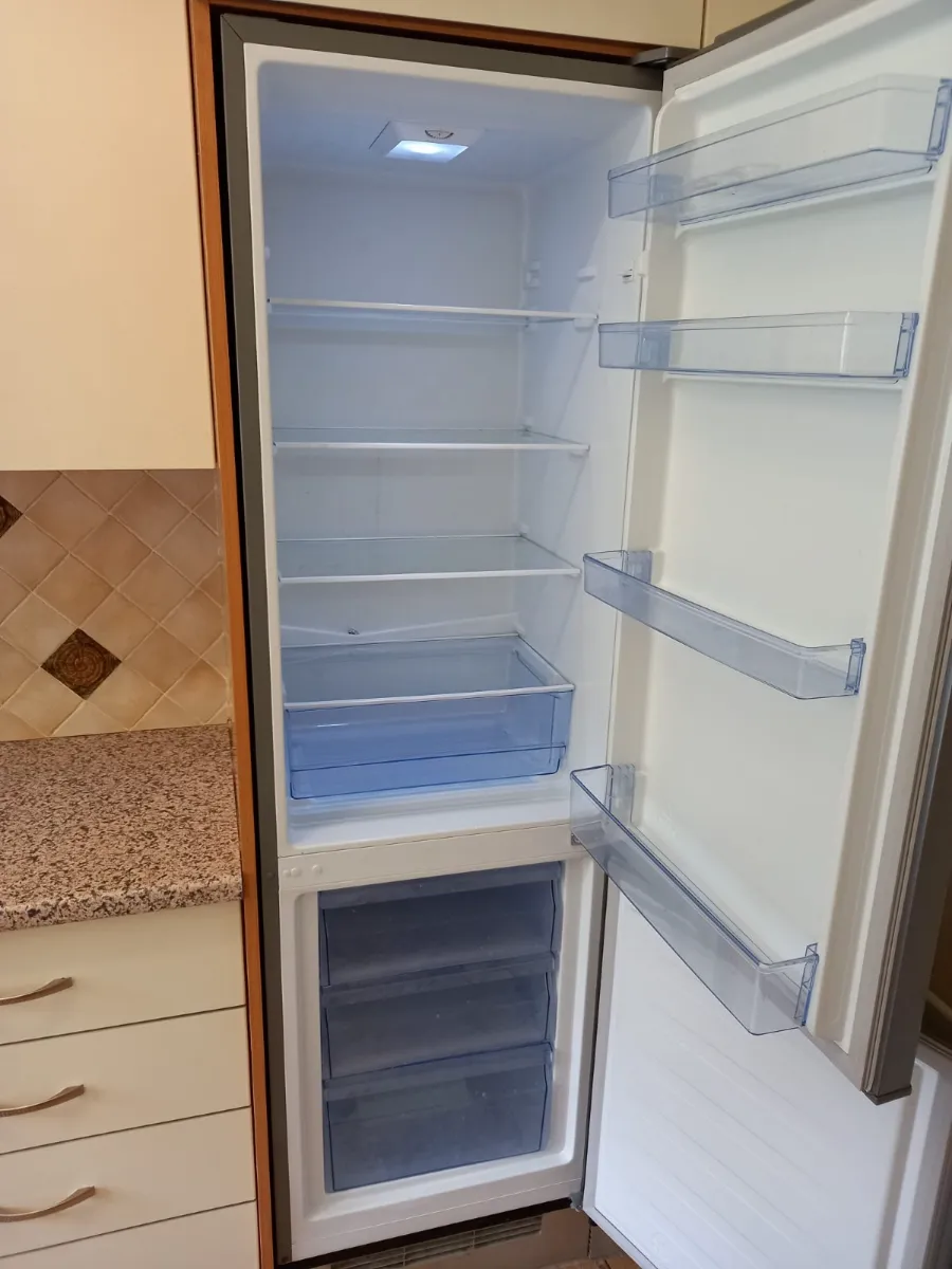 Fridge wiped clean, shelf by shelf, cleaned by Spark & Shine Cleaning Co. in Myrtle Beach, SC