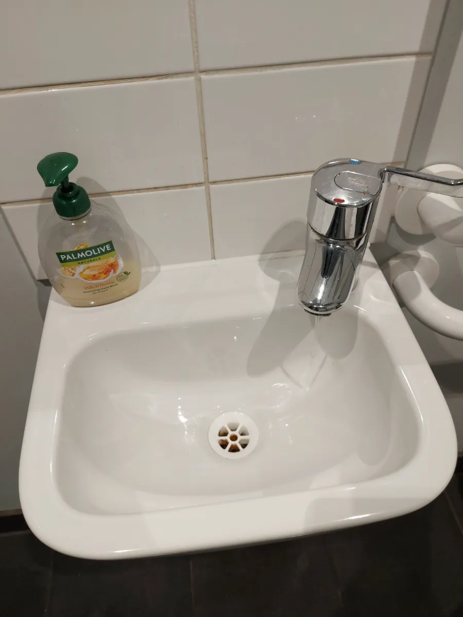 Hand sink and tiles left spotless, cleaned by Spark & Shine Cleaning Co. in Myrtle Beach, SC