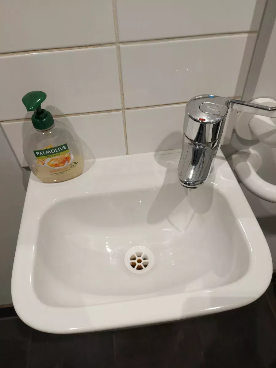 Hand sink and tiles left spotless, cleaned by Spark & Shine Cleaning Co. in Myrtle Beach, SC